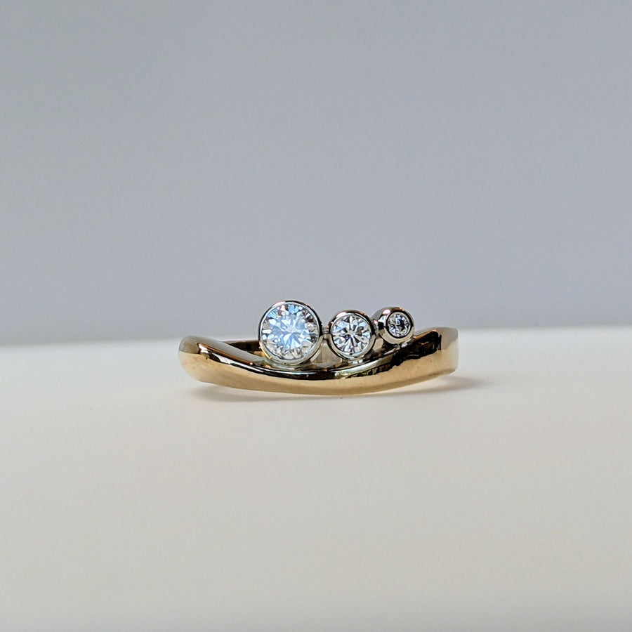 Graduated Bezel Diamond Ring