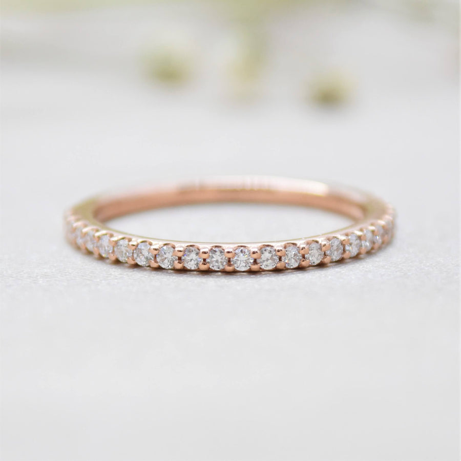rose gold shared prong diamond ring